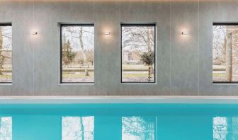 Indoor pool area at Graduate By Hilton Cambridge.