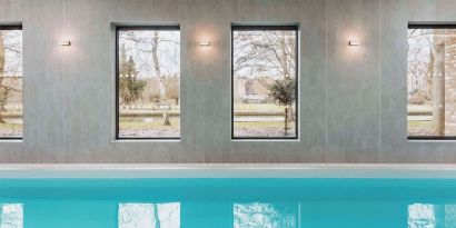 Indoor pool area at Graduate By Hilton Cambridge.
