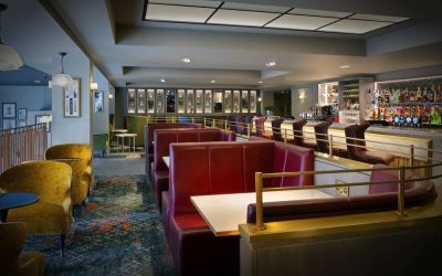 Hotel bar with comfortable seating, perfect for co-working at Leonardo Royal Hotel London City.