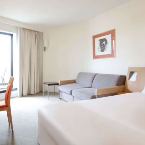 Day use superior room with work desk and living area at Novotel Manchester West.