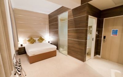 Bright and spacious day use room with private bathroom and workspace at The Wesley Euston Hotel.