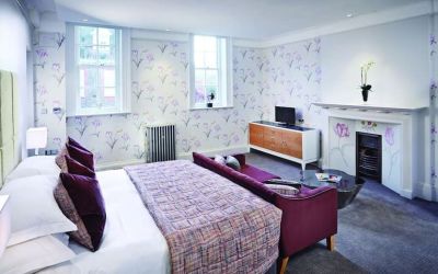 Day use room with king bed and sofa at Barnett Hill Hotel.