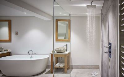 Guest bathroom with shower and tub at Barnett Hill Hotel.