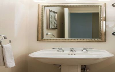 Guest bathroom with shower at Renaissance Newark Airport Hotel.