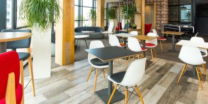 Comfortable lounge area with natural light at ibis Leicester City.
