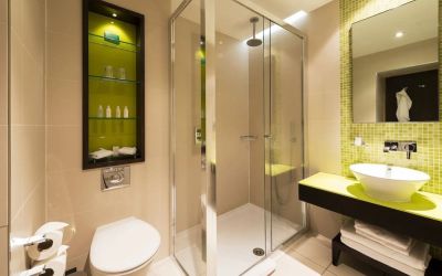 Guest bathroom with shower and free toiletries at Indigo London-Paddington Hotel.