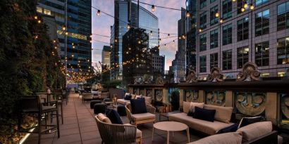 Rooftop terrace seating at The Knickerbocker Hotel.
