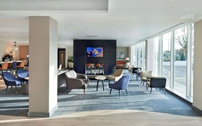 Bright and comfortable lobby lounge at Hyatt Place London Heathrow Airport.