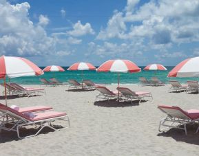 Cabanas and loungers available by the beach at SLS South Beach. 