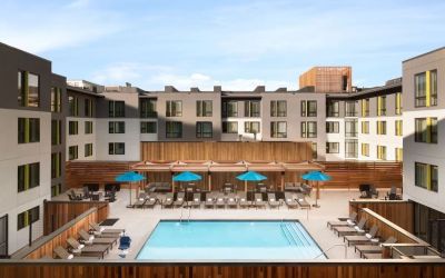 Loungers around outdoor pool at Embassy Suites Boulder.
