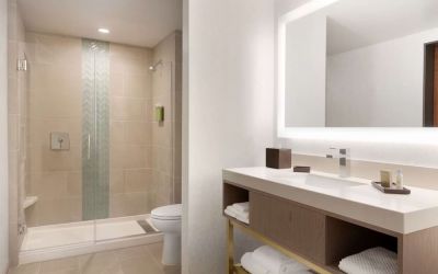 Guest bathroom with shower at Embassy Suites Boulder.
