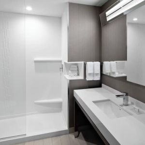 Guest bathroom with shower at Courtyard Delray Beach.
