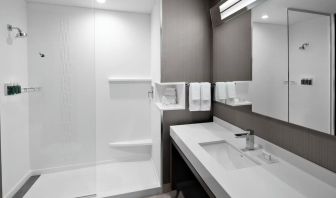 Guest bathroom with shower at Courtyard Delray Beach.
