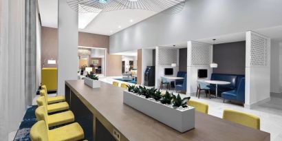Media pods and lounge area at Courtyard Delray Beach.
