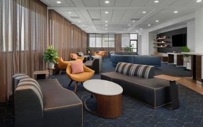 Lobby and coworking lounge at Courtyard By Marriott Cypress Anaheim.