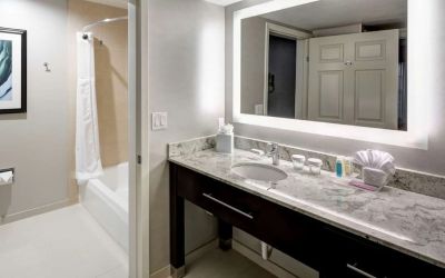Guest bathroom with shower and tub at Homewood Suites By Hilton San Jose Airport-Silicon Valley.