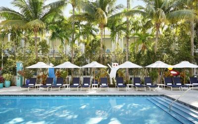Outdoor pool with loungers at Parrot Key Hotel & Villas.