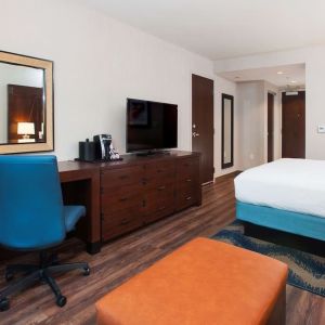 Day use room with work desk and sofa at Hilton Garden Inn Burbank Downtown.