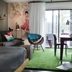 Day use room with sofa, work desk and balcony at Moxy Phoenix Tempe/ASU Area.