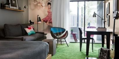 Day use room with sofa, work desk and balcony at Moxy Phoenix Tempe/ASU Area.