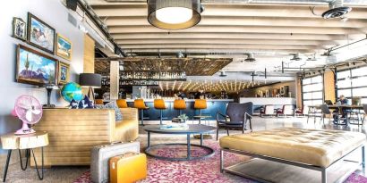 Lobby and coworking lounge at Moxy Phoenix Tempe/ASU Area.