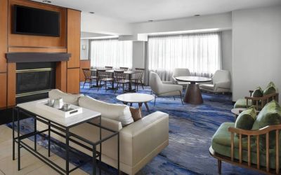 Lobby and coworking lounge at Fairfield Inn By Marriott Denver Airport.