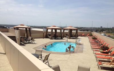 Refreshing outdoor pool in rooftop of Hyatt Regency Dallas.
