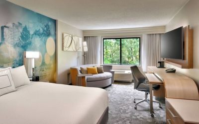 Day use room with sofa and work desk at Courtyard By Marriott Charlotte Airport/Billy Graham Parkway.