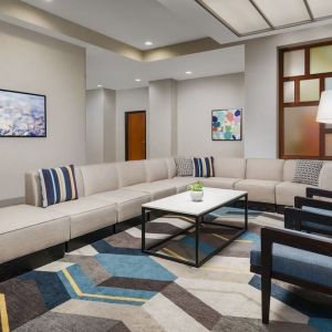 Lobby and coworking lounge at Hyatt HOUSE Fort Lauderdale Airport-South & Cruise Port.