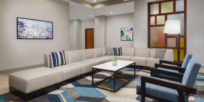 Lobby and coworking lounge at Hyatt HOUSE Fort Lauderdale Airport-South & Cruise Port.