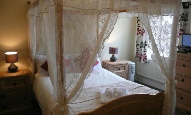King bed at Rothwell House Hotel.