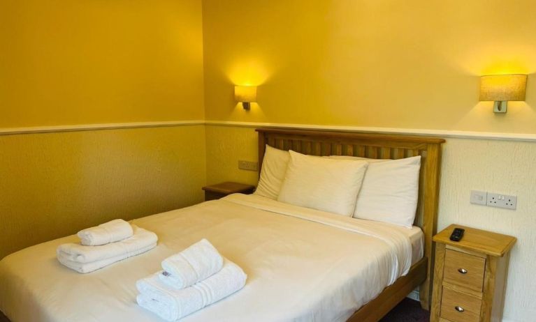 King bed at Rothwell House Hotel.
