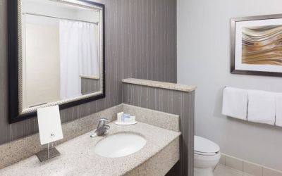 Guest bathroom with shower at Courtyard By Marriott Hattiesburg.