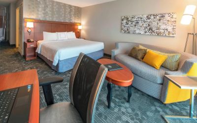 Day use room with work desk and sofa at Courtyard By Marriott Montgomery Prattville.