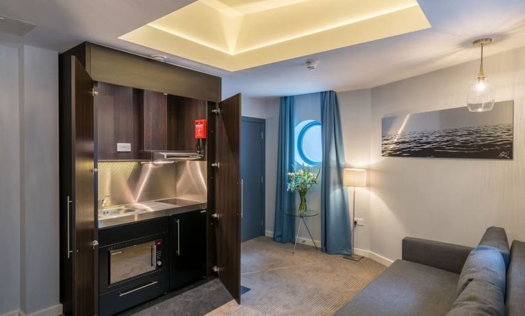 Day use studio suite with in-room kitchen and living area at Pelican London Residence & Hotel.