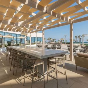 Outdoor seating at Hilton Skanes Monastir Beach Resort.