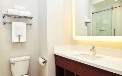 Guest bathroom with shower at Holiday Inn Express & Suites Corona.