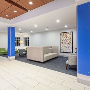 Lobby and coworking lounge at Holiday Inn Express & Suites Corona.