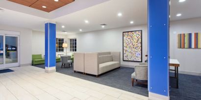 Lobby and coworking lounge at Holiday Inn Express & Suites Corona.