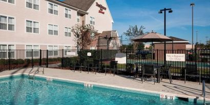 Refreshing outdoor pool at Residence Inn By Marriott Hattiesburg.