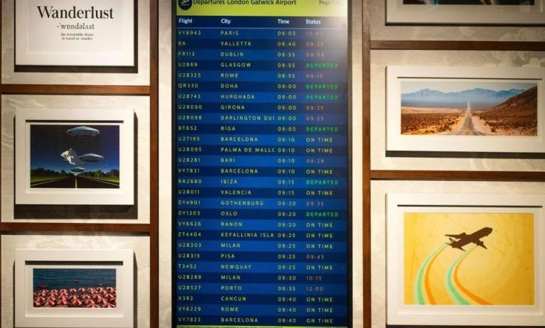 Lobby lounge with departures screen at Ibis London Gatwick Airport Hotel.