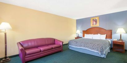 Spacious day use room with sofa at Blue Way Inn & Suites Wichita East.