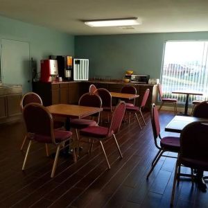 Dining area perfect for coworking at Blue Way Inn & Suites Wichita East.