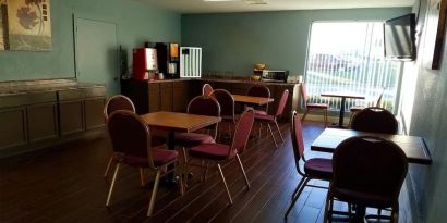 Dining area perfect for coworking at Blue Way Inn & Suites Wichita East.