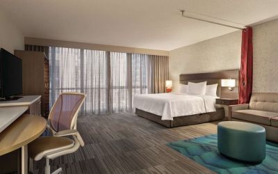 Spacious day use room with work desk and sofa at Home2 Suites By Hilton Chicago River North.