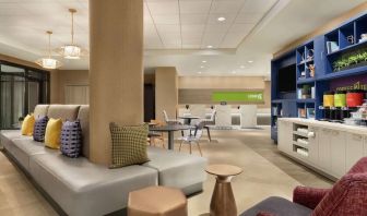 Lobby and coworking lounge at Home2 Suites By Hilton Chicago River North.
