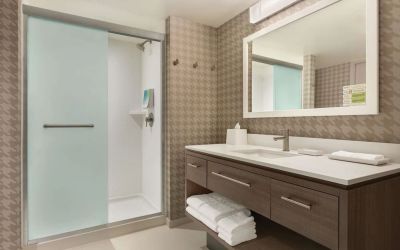 Guest bathroom with shower at Home2 Suites By Hilton Chicago River North.
