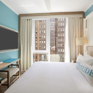 King room with TV at Margaritaville Resort Times Square.