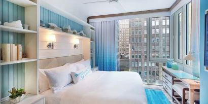 King bed with city views at Margaritaville Resort Times Square.