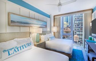 Day room with queen beds at Margaritaville Resort Times Square.